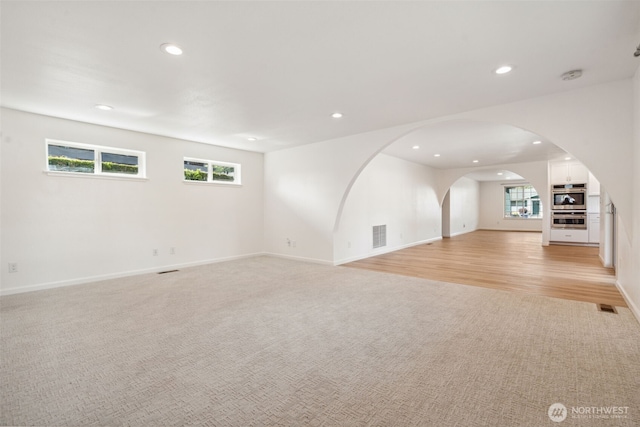 133 Bradley St, Walla Walla, WA 99362 - unfurnished living room with recessed lighting, light carpet, and baseboards