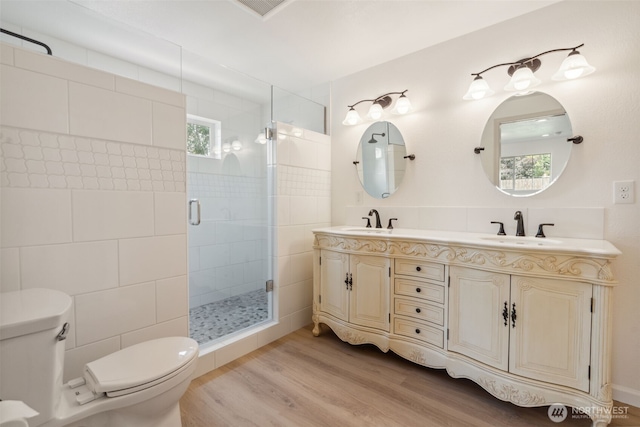 133 Bradley St, Walla Walla, WA 99362 - bathroom featuring toilet, wood finished floors, a shower stall, and double vanity