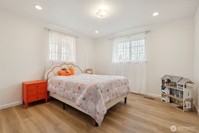 133 Bradley St, Walla Walla, WA 99362 - bedroom with multiple windows, light wood finished floors, baseboards, and recessed lighting