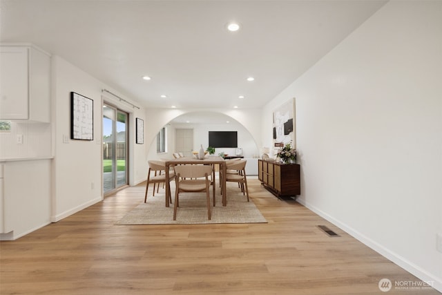 133 Bradley St, Walla Walla, WA 99362 - dining area featuring arched walkways, light wood finished floors, recessed lighting, and baseboards