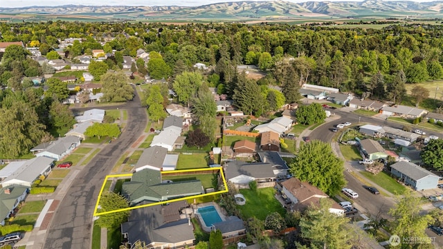133 Bradley St, Walla Walla, WA 99362 - aerial overview of property's location with property parcel outlined, mountains, and nearby suburban area