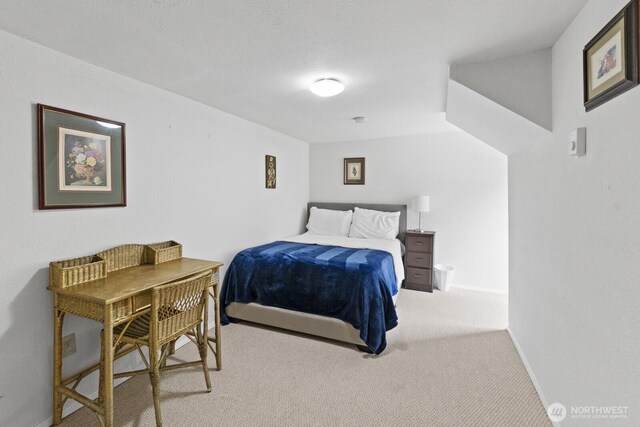 carpeted bedroom with baseboards