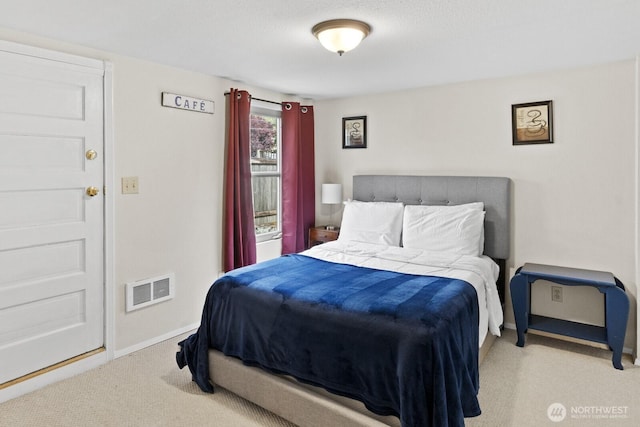 carpeted bedroom featuring baseboards