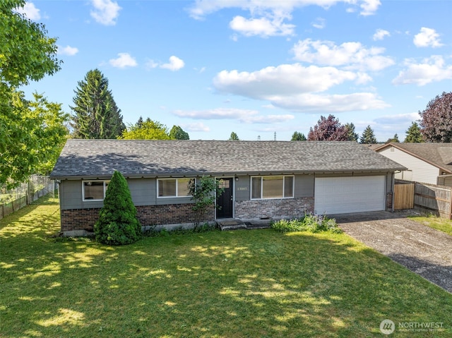 ranch-style home with brick siding, driveway, and a garage
