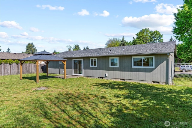 back of house featuring a gazebo