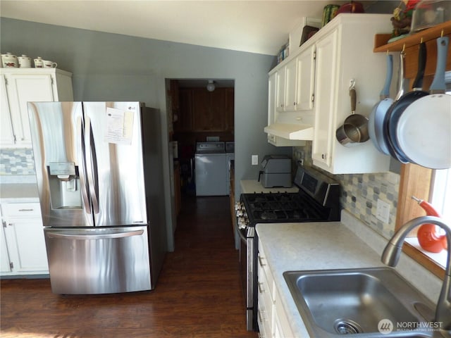 1061/2 Indian Ave E, Brewster, WA 98812 - kitchen with stainless steel appliances, washer / dryer, a sink, light countertops, and white cabinetry