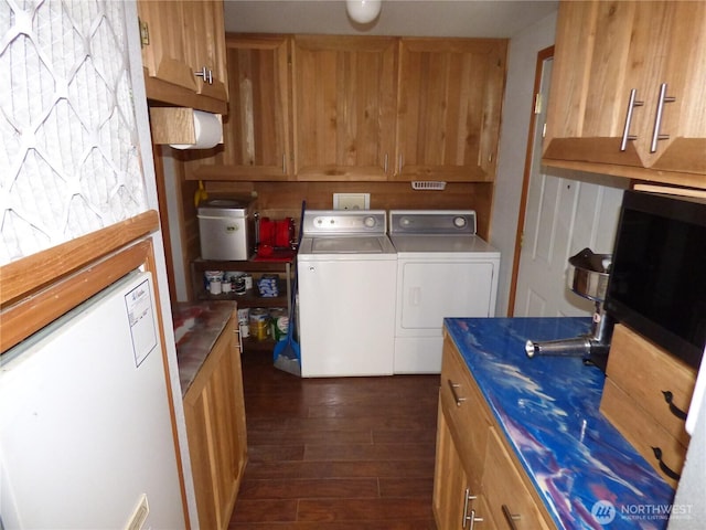 1061/2 Indian Ave E, Brewster, WA 98812 - washroom featuring dark wood-type flooring and separate washer and dryer