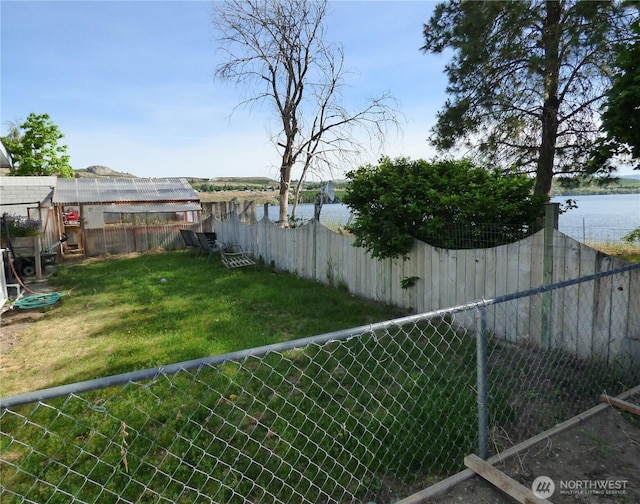 1061/2 Indian Ave E, Brewster, WA 98812 - view of yard with an exterior structure, an outdoor structure, and a water view