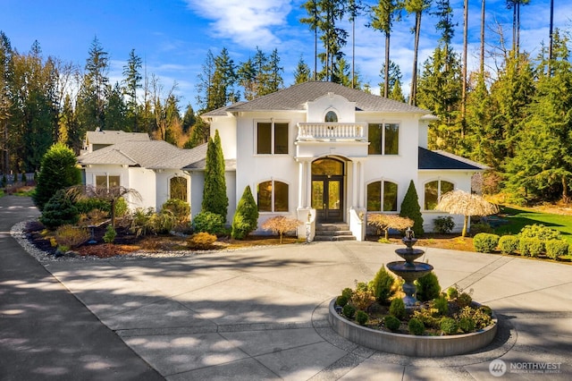 19516 67th Ave SE, Snohomish, WA 98296 - mediterranean / spanish home with curved driveway, french doors, and stucco siding