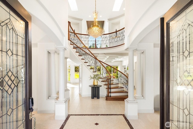 19516 67th Ave SE, Snohomish, WA 98296 - entryway with a towering ceiling, baseboards, stairway, and inlaid floor details