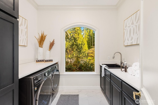 19516 67th Ave SE, Snohomish, WA 98296 - laundry room with washing machine and clothes dryer, cabinet space, light marble finish floors, crown molding, and baseboards