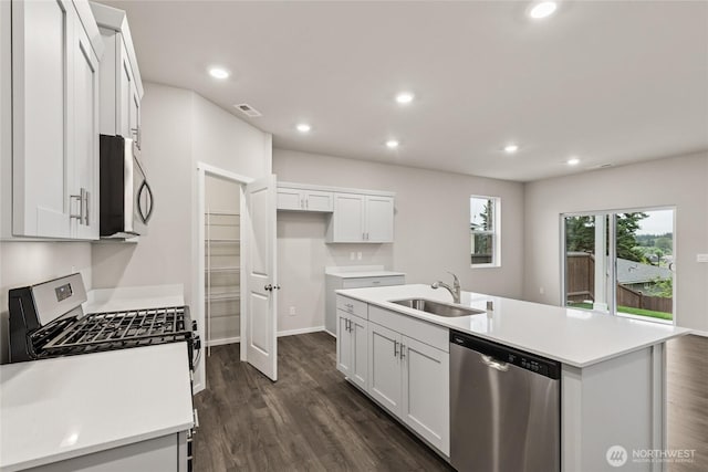 28307 74th Dr NW Unit 90, Stanwood, WA 98292 - kitchen featuring stainless steel appliances, white cabinetry, recessed lighting, dark wood finished floors, and light countertops