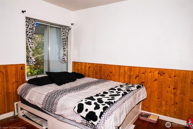 1803 Juniper St, Oroville, WA 98844 - bedroom with wainscoting, wood walls, and wood finished floors