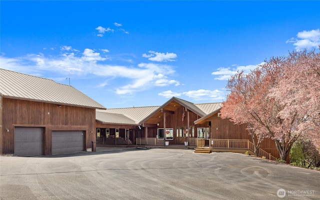2262 Lambert Rd, Cle Elum, WA 98922 - rustic home with metal roof and a garage