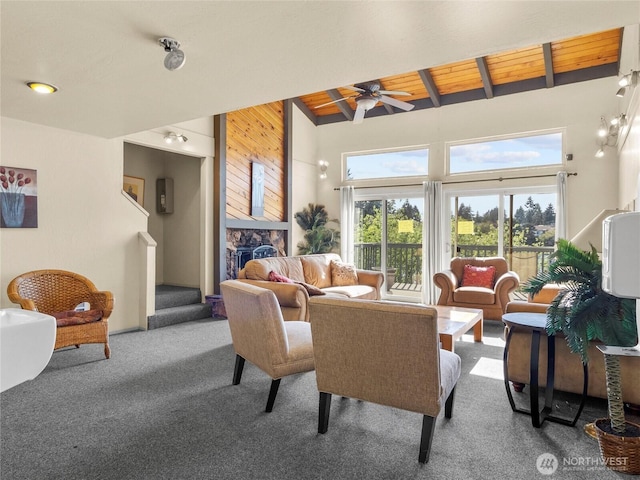 31003 14th Ave S Unit H1, Federal Way, WA 98003 - living area with carpet flooring, beam ceiling, ceiling fan, a fireplace, and wooden walls