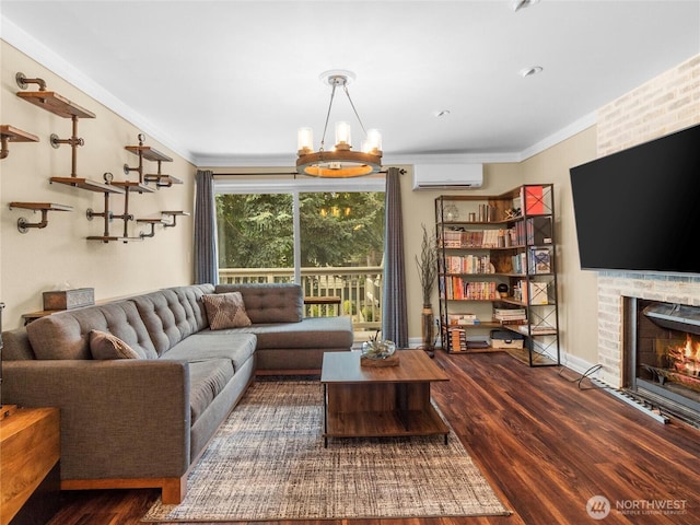1420 153rd Ave NE # 4004, Bellevue, WA 98007 - living area featuring a wall mounted air conditioner, wood finished floors, crown molding, a brick fireplace, and a chandelier