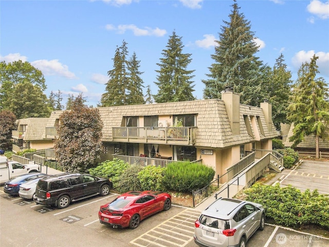 1420 153rd Ave NE # 4004, Bellevue, WA 98007 - view of building exterior with uncovered parking
