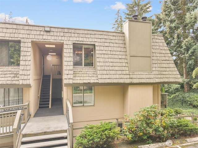 1420 153rd Ave NE # 4004, Bellevue, WA 98007 - view of front of home with a chimney and mansard roof