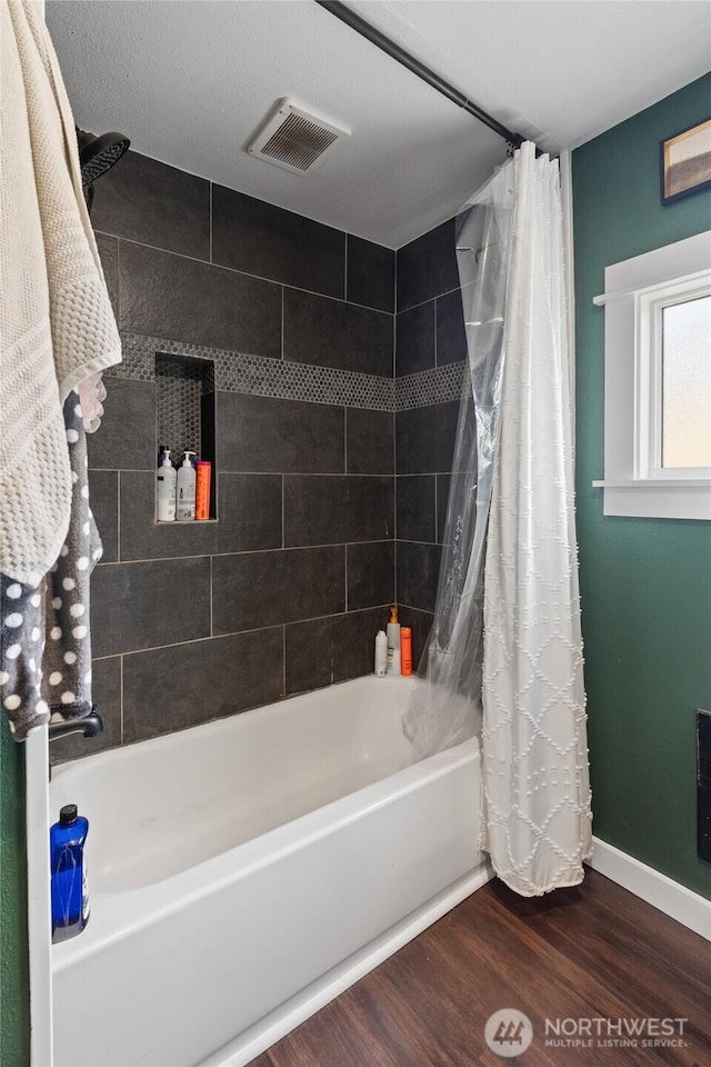 85 Rustemeyer Rd, Aberdeen, WA 98520 - bathroom with wood finished floors, shower / bathtub combination with curtain, and baseboards
