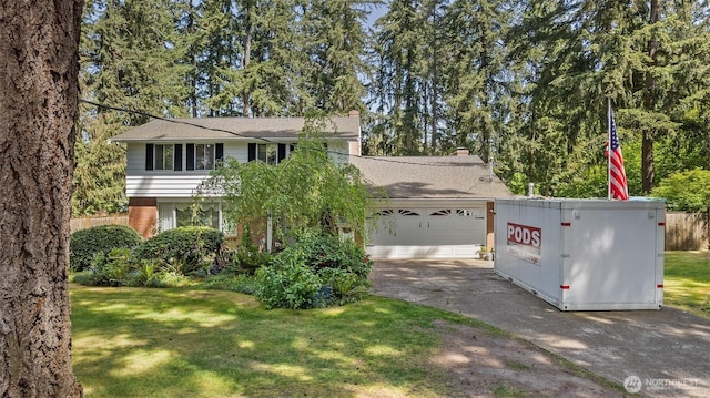 3123 163rd St E, Tacoma, WA 98446 - view of front of property featuring concrete driveway, a front lawn, and brick siding