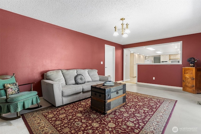 3123 163rd St E, Tacoma, WA 98446 - living area featuring a chandelier, a textured ceiling, and baseboards
