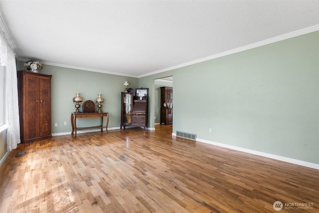 3123 163rd St E, Tacoma, WA 98446 - living room featuring light wood finished floors, ornamental molding, and baseboards