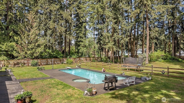 3123 163rd St E, Tacoma, WA 98446 - view of pool with a diving board, a trampoline, an in-ground hot tub, and a patio