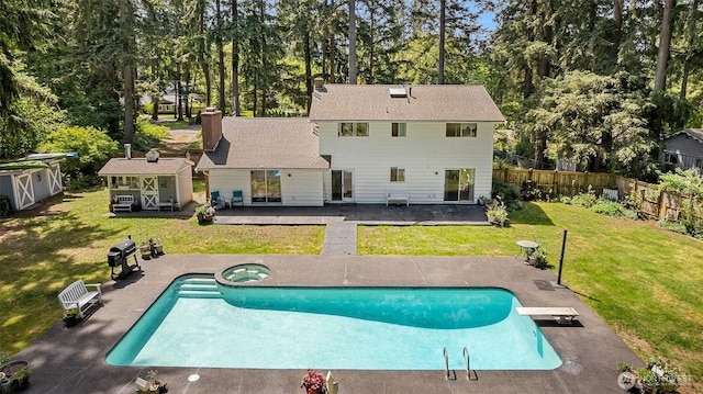 3123 163rd St E, Tacoma, WA 98446 - view of swimming pool featuring an in-ground hot tub, a patio, a diving board, and view of scattered trees