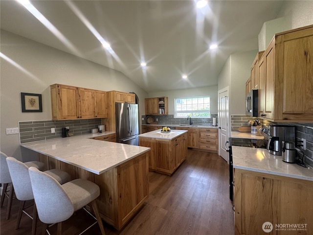 22 Rooster Flats Rd, Oroville, WA 98844 - kitchen with stainless steel appliances, backsplash, a sink, dark wood-style flooring, and light countertops