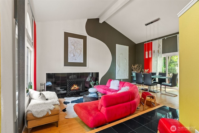 living room with wood finished floors and a fireplace