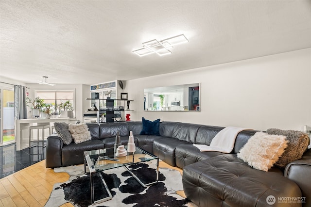 living room featuring a textured ceiling