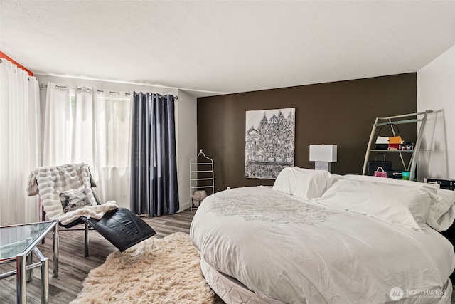 bedroom with wood finished floors