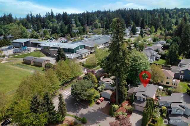 aerial view of residential area with a forest