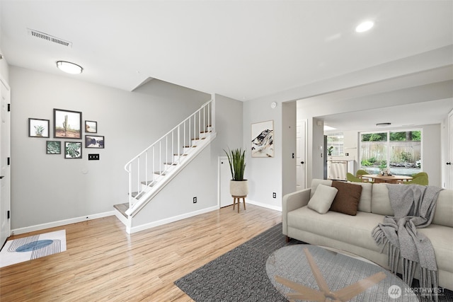 3454 Deer Pointe Ct, Bellingham, WA 98226 - living area featuring stairs, wood finished floors, baseboards, and recessed lighting