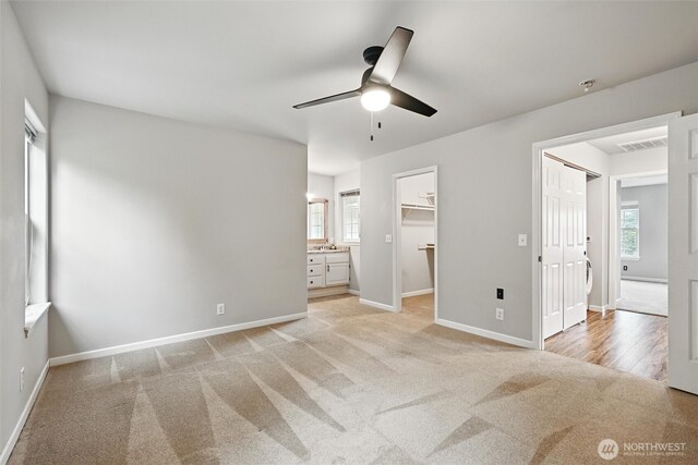3454 Deer Pointe Ct, Bellingham, WA 98226 - unfurnished bedroom with baseboards, light carpet, and a ceiling fan