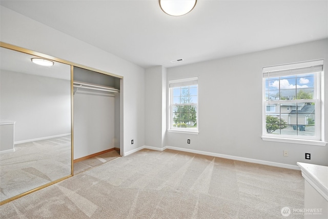 3454 Deer Pointe Ct, Bellingham, WA 98226 - unfurnished bedroom featuring light carpet, baseboards, and a closet