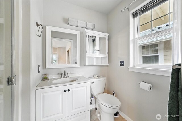 3454 Deer Pointe Ct, Bellingham, WA 98226 - bathroom featuring toilet, baseboards, and vanity