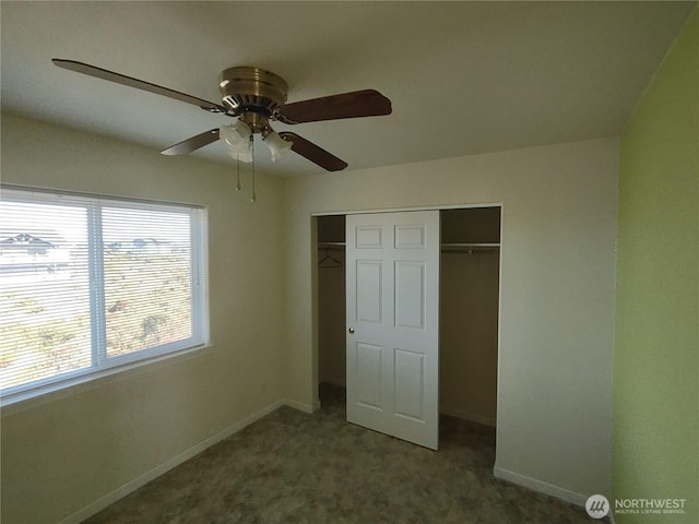 unfurnished bedroom with a closet, baseboards, carpet, and ceiling fan