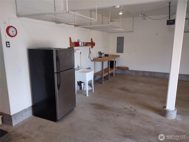 1400 Ocean Shores Blvd SW, Ocean Shores, WA 98569 - garage with freestanding refrigerator and electric panel
