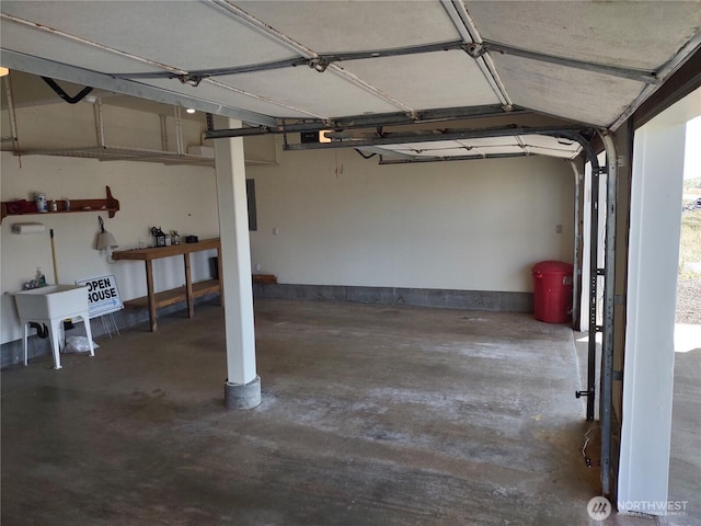 1400 Ocean Shores Blvd SW, Ocean Shores, WA 98569 - garage featuring a sink and a garage door opener
