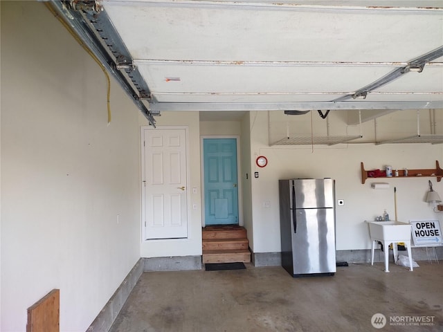1400 Ocean Shores Blvd SW, Ocean Shores, WA 98569 - garage featuring freestanding refrigerator and a sink