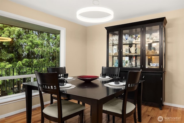 10504 Dixon Dr S, Seattle, WA 98178 - dining room featuring light wood-style flooring and baseboards