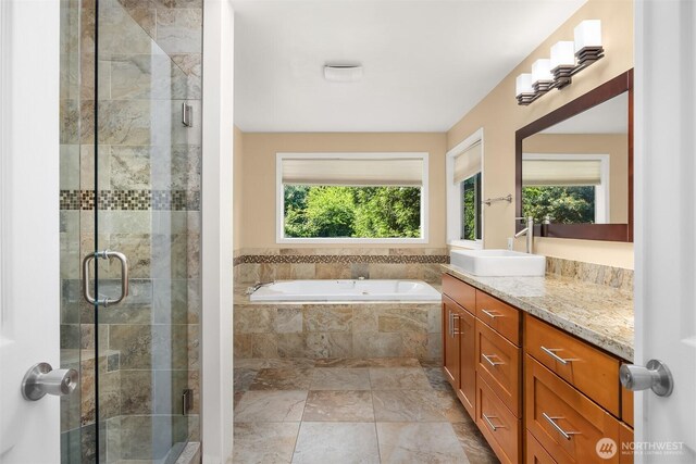 10504 Dixon Dr S, Seattle, WA 98178 - full bath featuring vanity, a garden tub, and a stall shower
