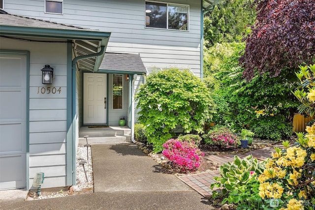 10504 Dixon Dr S, Seattle, WA 98178 - view of exterior entry featuring a shingled roof