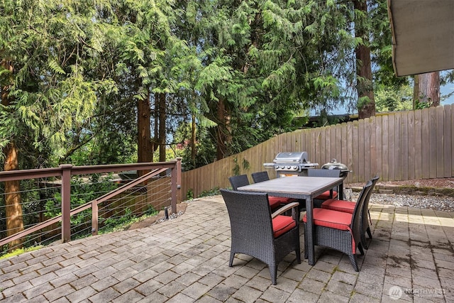 10504 Dixon Dr S, Seattle, WA 98178 - fenced backyard featuring outdoor dining space and a patio