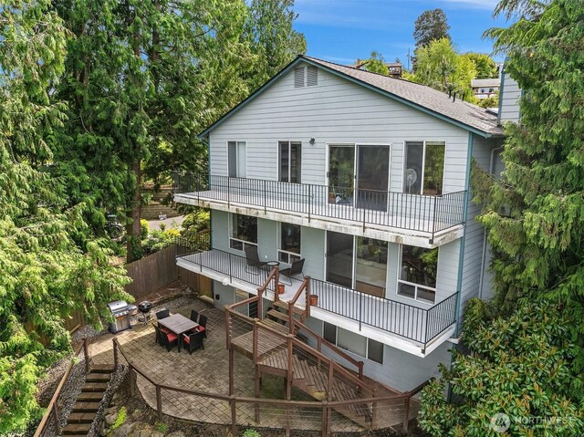 10504 Dixon Dr S, Seattle, WA 98178 - rear view of house with stairs, a deck, and a balcony