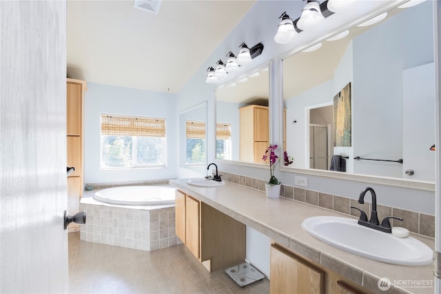 104 Jack Fir Ct, Packwood, WA 98361 - bathroom featuring tile patterned floors, a garden tub, a shower stall, double vanity, and lofted ceiling