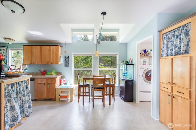 104 Jack Fir Ct, Packwood, WA 98361 - kitchen featuring washer / clothes dryer, tile counters, and decorative light fixtures