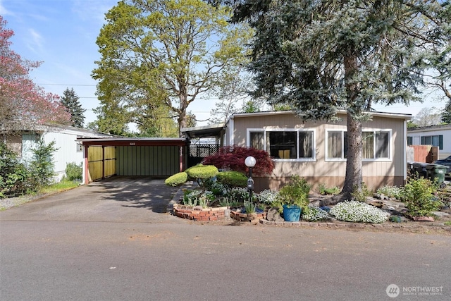 3213 85th St S Unit 48, Lakewood, WA 98499 - view of home's exterior featuring driveway and an attached carport