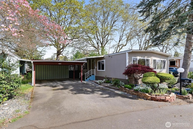 3213 85th St S Unit 48, Lakewood, WA 98499 - manufactured / mobile home with driveway and an attached carport